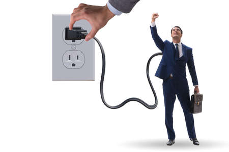 Businessman being powered by electricity and plugの写真素材