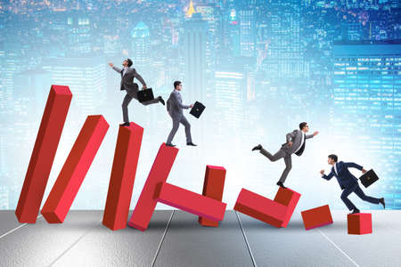 Business people in a collapsing economy conceptの写真素材