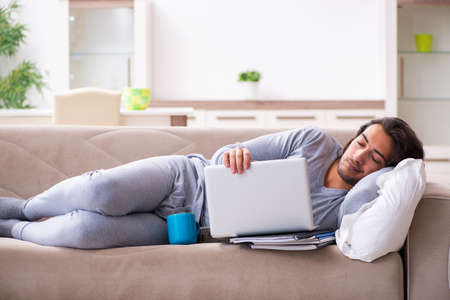 Young male employee freelancer working from home