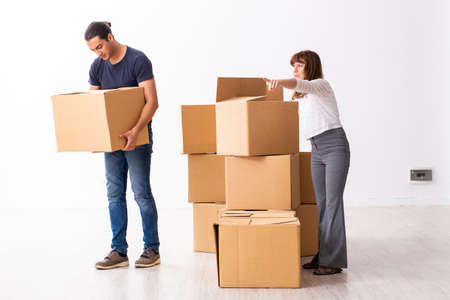 Young pair and many boxes in divorce settlement concept