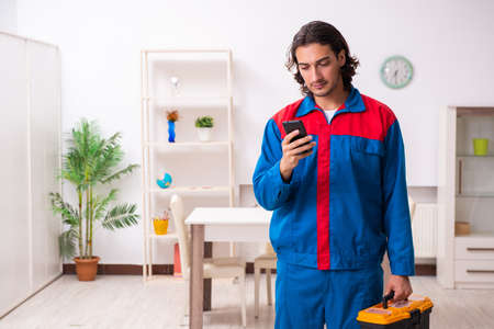 Young male carpenter working indoorsの写真素材