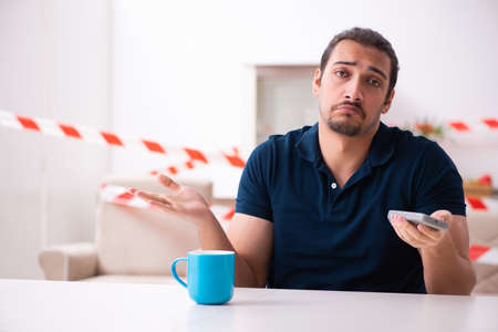 Young man at home in the self-isolation concept