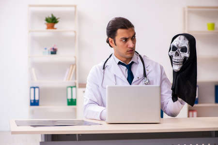 Male devil doctor working in the clinicの写真素材