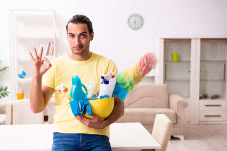 Young male contractor doing housework at homeの写真素材