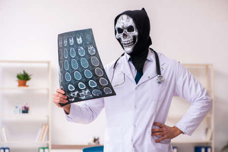Male devil doctor radiologist working in the clinicの写真素材