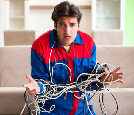 Electrician contractor with tangled cablesの写真素材