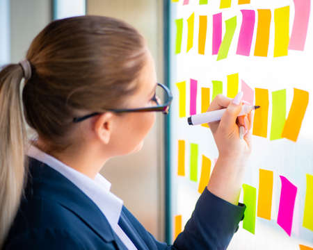 Beautiful female employee with many conflicting prioritiesの写真素材