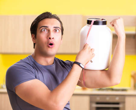 Young man blogging about food supplementsの写真素材