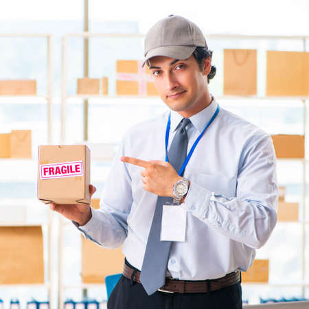 Male employee working in box delivery relocation serviceの写真素材