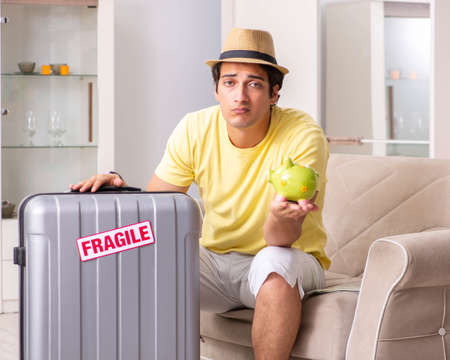Man going on vacation with fragile suitcasesの写真素材