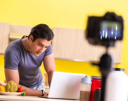 Young man blogging about food supplementsの写真素材