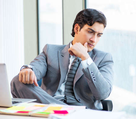 Young successful businessman working at the officeの写真素材