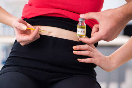 Female diabetic patient visiting young male doctor