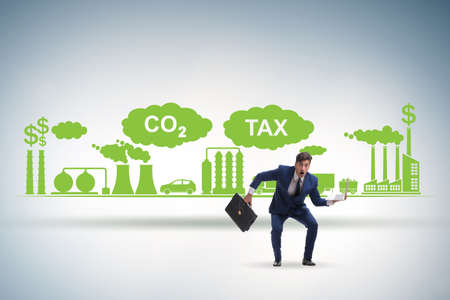 Businessman in carbon tax conceptの写真素材
