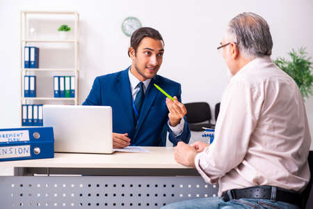 Financial advisor giving retirement advice to old manの写真素材