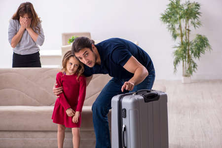 Young couple and their daughter in family conflict conceptの写真素材