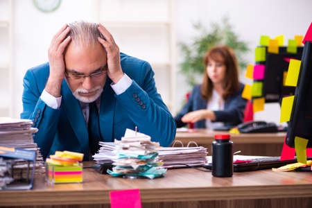 Two employees and excessive work in the office