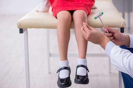 Small girl visiting young doctorの写真素材