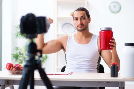 Young male blogger in dieting conceptの写真素材