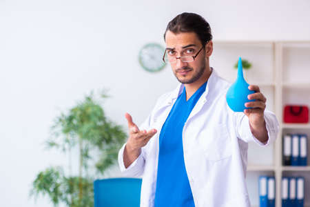 Young male doctor gastroenterologist working in the clinicの写真素材