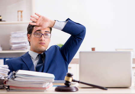 Young handsome judge working in courtの写真素材