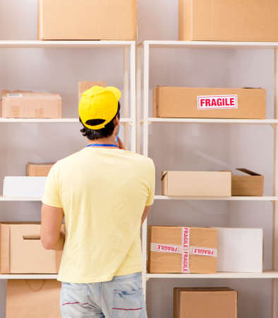 Handsome contractor working in box delivery relocation service