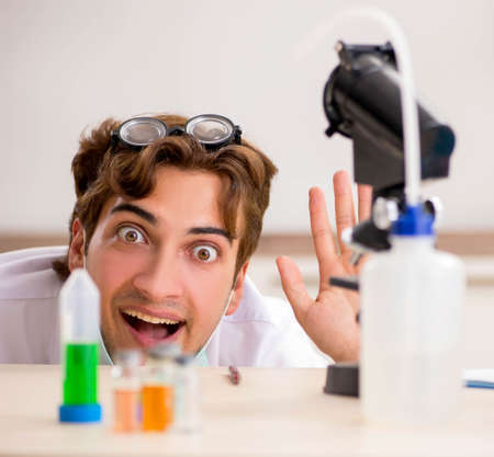 Funny crazy chemist doing experiments and testsの写真素材
