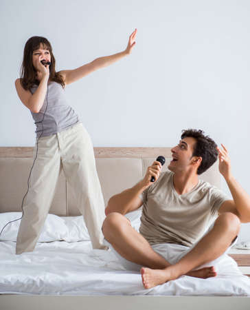 Happy couple in the bedの写真素材