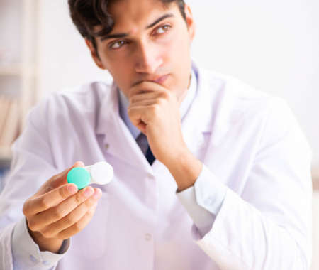 Young handsome doctor oculist working at the clinicの写真素材