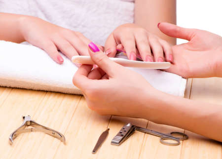 The woman hands during manicure sessionの写真素材