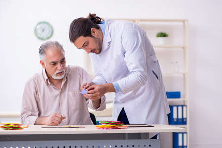 Doctor and patient suffering from Alzheimer diseaseの写真素材