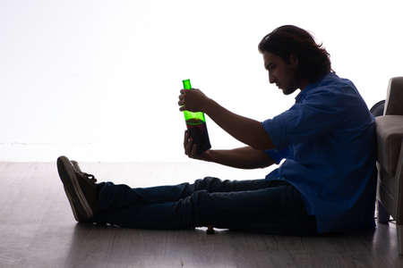 Young man suffering from alcoholism