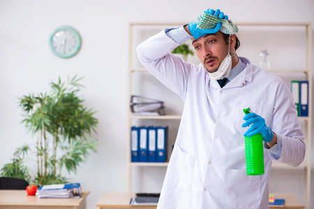 Young male doctor virologist in the officeの写真素材