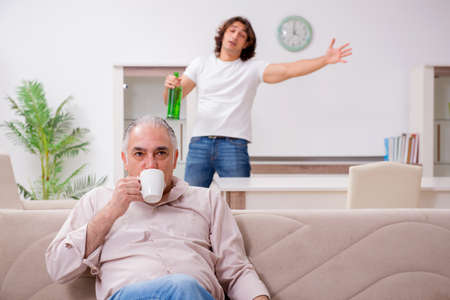 Man with drinking problem and the familyの写真素材