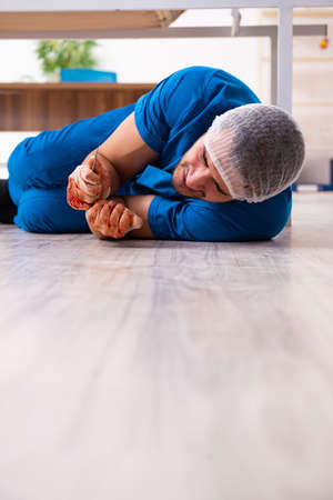 Young doctor surgeon in fatal negligence conceptの写真素材