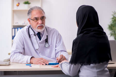 Arab woman visiting experienced doctorの写真素材
