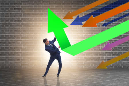 Recovery concept with businessman and chartsの写真素材