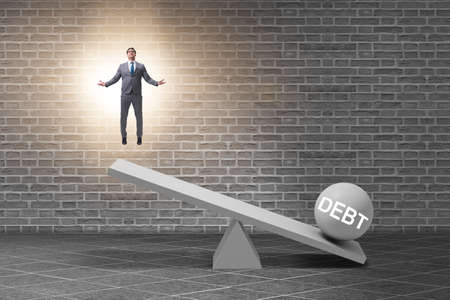 Debt and loan concept with businessman and seesawの写真素材