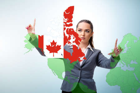 Concept of immigration to Canada with virtual button pressingの写真素材