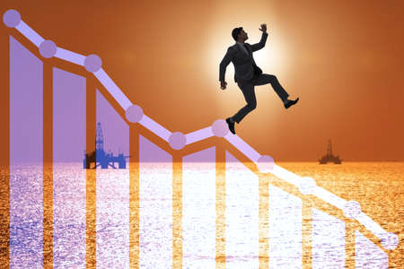 Crisis in the oil industry with businessmanの写真素材