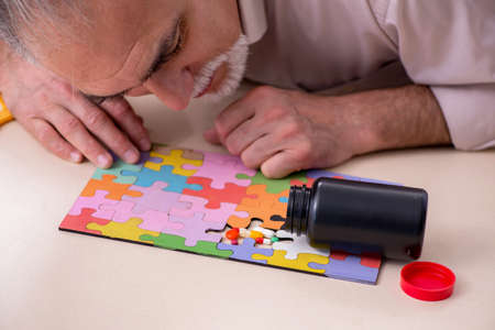 Doctor and patient suffering from Alzheimer disease