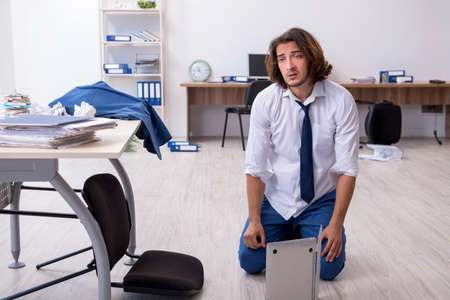 Young male employee unhappy with his workの写真素材