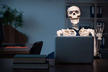 Young employee working in the office night time