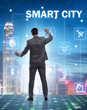 Concept of smart city with businessman pressing buttonsの写真素材