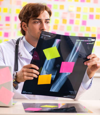 Male doctor with many conflicting prioritites