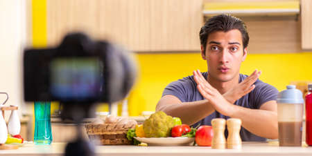 Young man blogging about food supplementsの写真素材