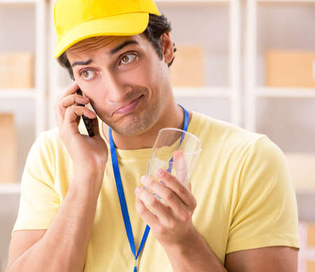 Handsome contractor working in box delivery relocation serviceの写真素材
