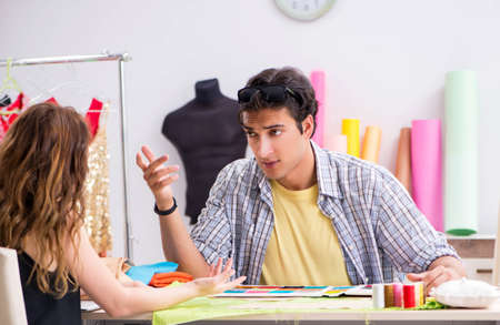 Young tailor working in his workshopの写真素材