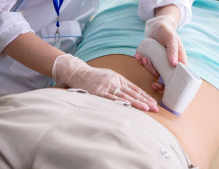 The young man visiting radiologyst for ultrasound procedureの写真素材