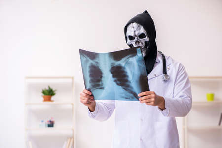 Male devil doctor radiologist working in the clinicの写真素材